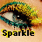Pixelated eye with teal and yellow eyelashes, black pupil, white highlight, beige background, and 'Sparkle' text below in bold black letters outlined in yellow.