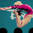 A person in a pink swimsuit dives into water, arms extended forward, legs bent at the knees, with a blue background and white text partially visible.