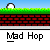 Pixelated character in red outfit with white head performs actions on grassy platform above brick wall, text "Mad Hop" repeated below.
