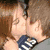 Two figures in close embrace with one figure holding a microphone, transitioning to an eye and then a person on a red structure.