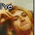 A 4x3 contact sheet of animated frames showing a person with long blonde hair making hand gestures, accompanied by pixelated text forming the phrase "I've Been Locked Inside Your Heart Shaped Box For Weeks" across multiple frames.