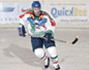 Animated sequence of hockey players in white jerseys with green and red accents, blue helmets, on an ice rink with visible boards and advertisements.