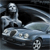 Pixelated image of a silver car with a driver figure, dark background, and motion blur effects on the vehicle's right side.