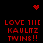 Red pixelated text on black background with animated heart and starburst symbols above four identical text blocks.