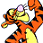 Tigger character in orange and black stripes with yellow belly, holding a pink balloon while raising one arm against white background.