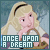Pixelated image of a blonde woman with a headband holding a round object, overlaid with text reading "ONCE UPON A DREAM" in blocky letters.