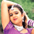 Static pixelated image of a person in profile wearing purple clothing with white collar, dark hair tied back, red lips, and light skin against green background.
