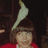 A pixelated image shows a person with brown hair and a red top, with a white bird on their head, against a dark background, next to blue text reading "You Have A BIRD ON YOUR HEAD!".
