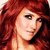 Pixelated close-up of a person with long red hair, light skin tone, and visible eye makeup including eyeliner.