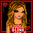 Pixelated image of a person with long brown hair wearing sunglasses and a red shirt with white text, surrounded by pixel hearts.