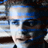 Static 48x48 pixel icon showing a heavily pixelated close-up of a person's face with blue and brown tones, likely from an early digital image or low-resolution source.