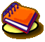 A small orange journal with purple binding and white pages rests on a yellow circular base, viewed from an angled perspective.