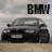 Static pixelated image of a dark sedan car with "BMW" text above it on a light background.