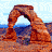 Animated contact sheet of a desert rock formation with multiple arches, displayed in 3x3 grid across eight sampled frames showing sequential motion changes.