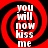 Four identical display red and black spiral patterns with white text reading "YOU WILL NOW KISS ME" in a pixelated font