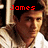 A pixelated image of a person with long brown hair wearing a white shirt, with red text above the head reading 'James Lafferty' in a digital font.
