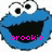 Two blue Cookie Monster faces side-by-side with large white eyes and black pupils, both smiling with open mouths showing black interiors, each with pink text below the mouth.