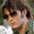 A pixelated image of a person with brown hair and sunglasses, next to green text reading 'Kevin' on white background.