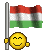 A pixelated yellow smiley face holds a red-white-green striped flag on a gray pole, with three variations of the flag's wave pattern visible across frames.