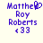Pixelated blue text on light background shows 'Matthew Roy Roberts' with heart symbol and '<33' in two side-by-side frames, one frame missing the heart.