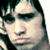 A pixelated image of a person with dark hair and heavy eye makeup, next to purple text reading "Its Brendon Bitch!" on black background.