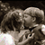 A four- displays a grayscale photo of two people embracing, with text overlays and colorful star patterns on white backgrounds