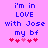 Pixelated text on pink background with blue letters and red/pink hearts, showing two identical static frames with slight heart animation.