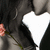 A static image shows a person with dark hair holding a white heart-shaped object, with text on the right side.