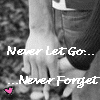 Black-and-white photo of two hands clasped together with text overlay reading 'Never Let Go... ...Never Forget' and a small pink heart symbol.
