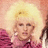 Pixelated image of a person with voluminous blonde hair and pink clothing, split into four quadrants with blue text overlays reading "EEW" and "A Freakish Man Lady!".