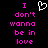 Black background with pink pixelated text reading "I don't wanna be in love" and a white heart outline above the first line.