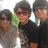 Pixelated photo of three people with dark hair and sunglasses on the left, purple text reading "Hard Core JB Fan <3" on the right.