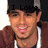 A person wearing a dark cap and brown hoodie with white drawstrings, smiling, with text overlays changing across frames.