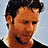 A 4-frame contact sheet of a pixelated animated icon featuring three distinct headshots of Russell Crowe in various poses and expressions, with the text "Coolbuddy.com" on a black background in the bottom-right frame.