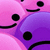 Pixelated pink and purple cartoon faces with black eyes and mouths, some smiling, others frowning, arranged in overlapping clusters.