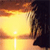 A static pixelated image shows a silhouetted figure standing on a beach at sunset with a bright sun low on the horizon and orange-yellow sky.