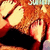 A pixelated close-up of a creature's mouth with sharp teeth and red accents, showing subtle animation changes in the lower jaw.
