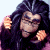 A 50x50 pixel animated buddy icon featuring a character with long dark hair and a black top on the left, next to green text reading "Original Icons .com" on a solid green background.