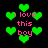 Pixelated green hearts and pink text 'i love this boy' on black background with animated heart movement.