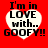 Red background with four white heart-shaped text boxes containing black pixelated text reading "I'm in LOVE with.. GOOFY!!" arranged in a