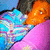 Pixelated image of two figures in close physical proximity, one with orange hair and the other with blue hair, against a blue and pink background.