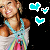 Pixelated image of a person in a white top with blue straps and rainbow accents, surrounded by cyan heart-shaped icons on black background.