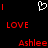 Pixelated red text and symbols on black background with white heart outline, showing 'LOVE' above 'Ashlee' in two identical side-by-side sections.