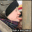 Pixelated image of a person in winter clothing with blue text on a bright blue background.