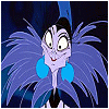 Animated cartoon character with purple skin, blue feathered collar, and large blue earrings against dark background.