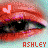 Pixelated close-up of a person's eyes with red lips, featuring an animated heart symbol above the left eye and 'ASHLEY' text below.