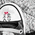 Pixelated icon shows two figures under a white canopy with black outline, one figure holding red heart above the other against gray background.