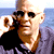 Static pixelated image of a man with sunglasses and a beard holding a black cat against a blue background.