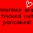 Red background with pixelated white heart symbol above black text repeating 'Waffles are tricked out pancakes!' in three lines.