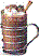 A pixelated static image of a dark beverage in a glass mug with a handle, topped with whipped cream and a straw.